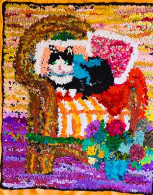 chat fauteuil - Tsilla Slakmon