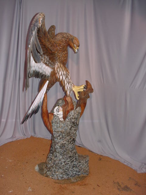 Side view of Golden Eagle with eaglettes - John Elsebusch